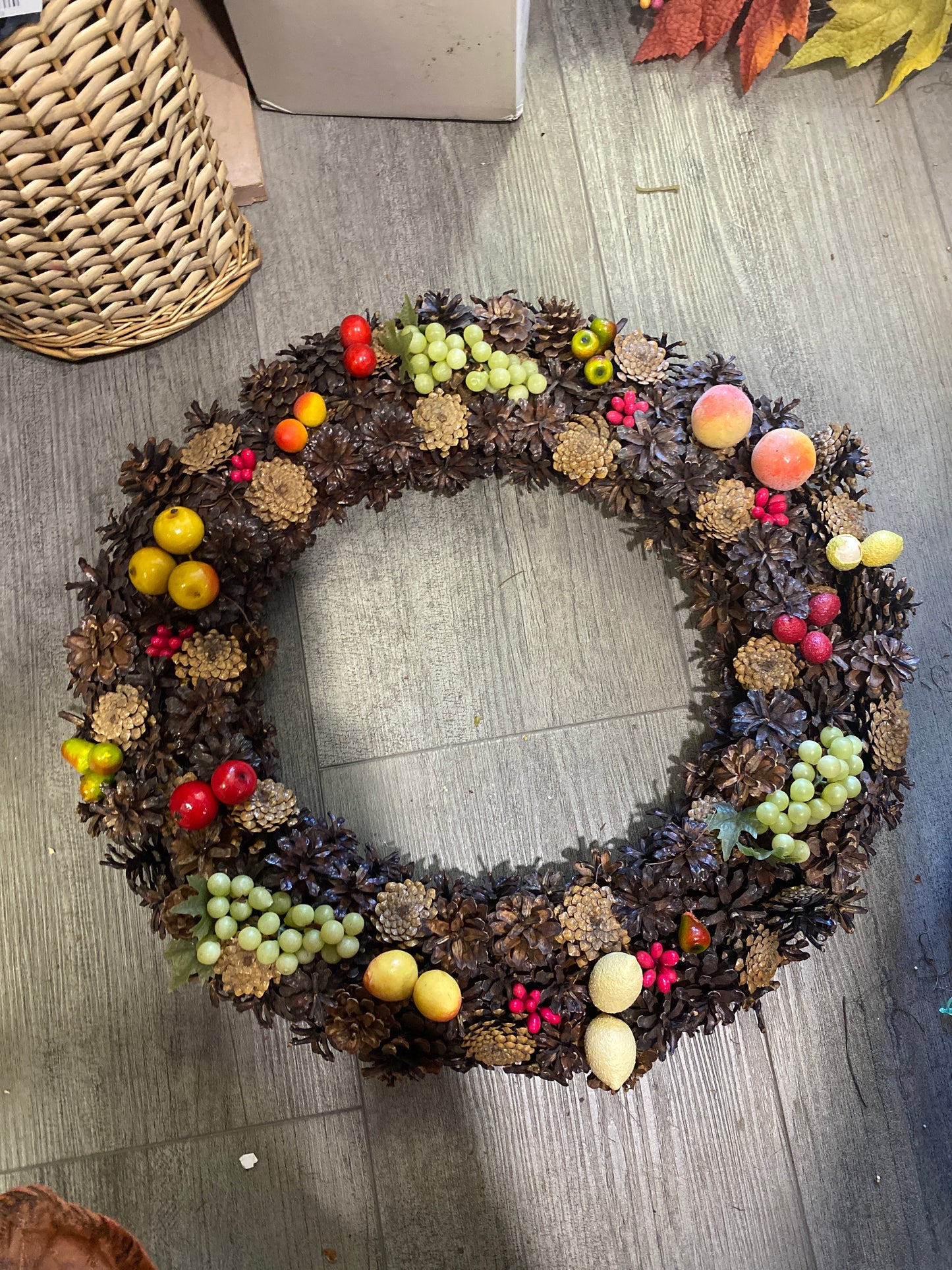 (1646) booth #282 fruit/pine cone wreath