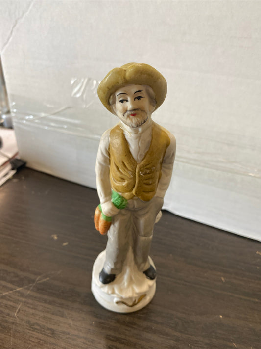 (1470) man holding carrots figure